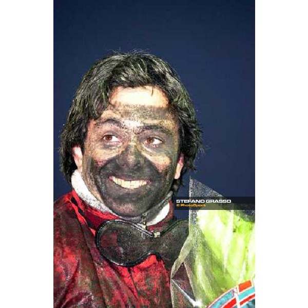 \'Pippo Gubellini muddy and smiling after winning two races at Plateau de Gravelle Paris, Vincennes january 26 2003-ph.Stefano Grasso\' 